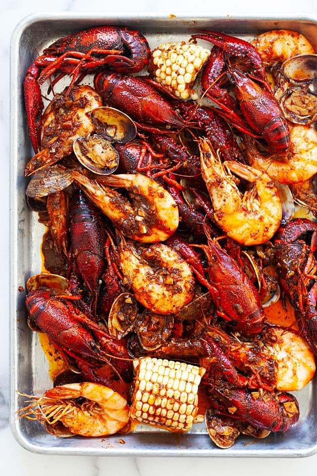 Seafood boil in a sheet pan, ready to be served.