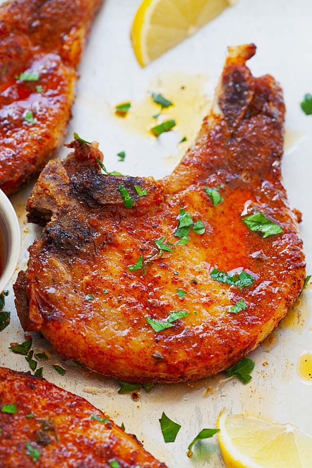 4 ingredient oven baked pork chops with bone-in pork chops, butter, dry rub and thyme.