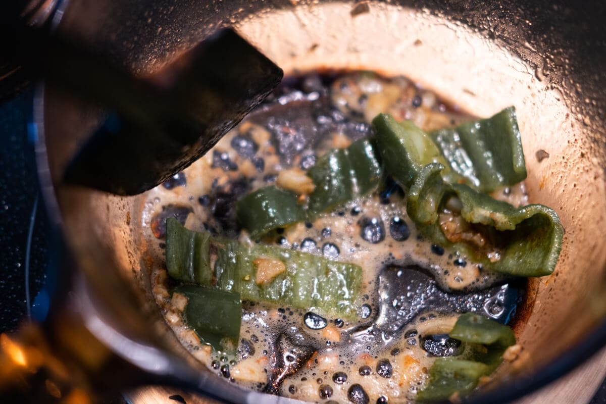Garlic and jalapeno in a sauce pan. 