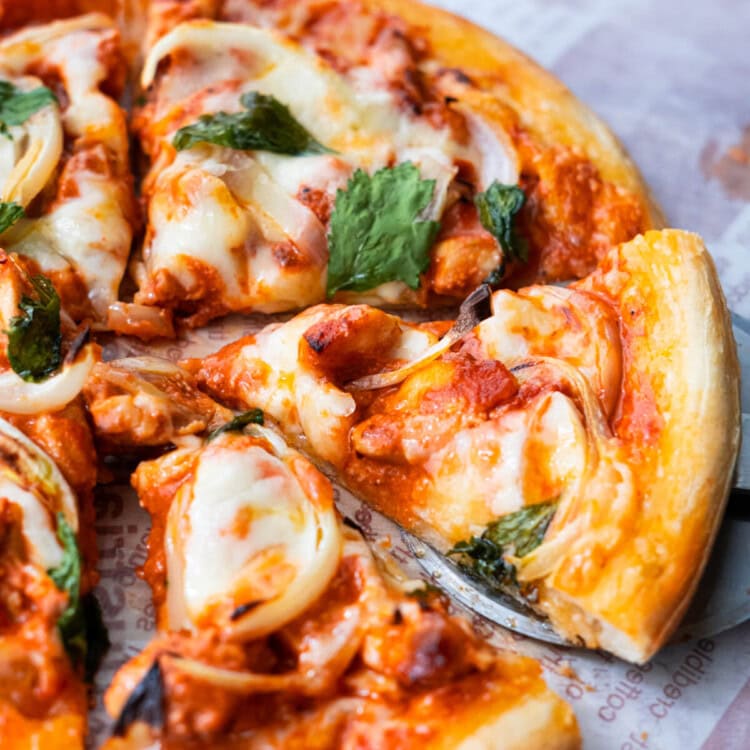 Easy and delicious homemade Indian pizza with chicken tikka masala as pizza topping.