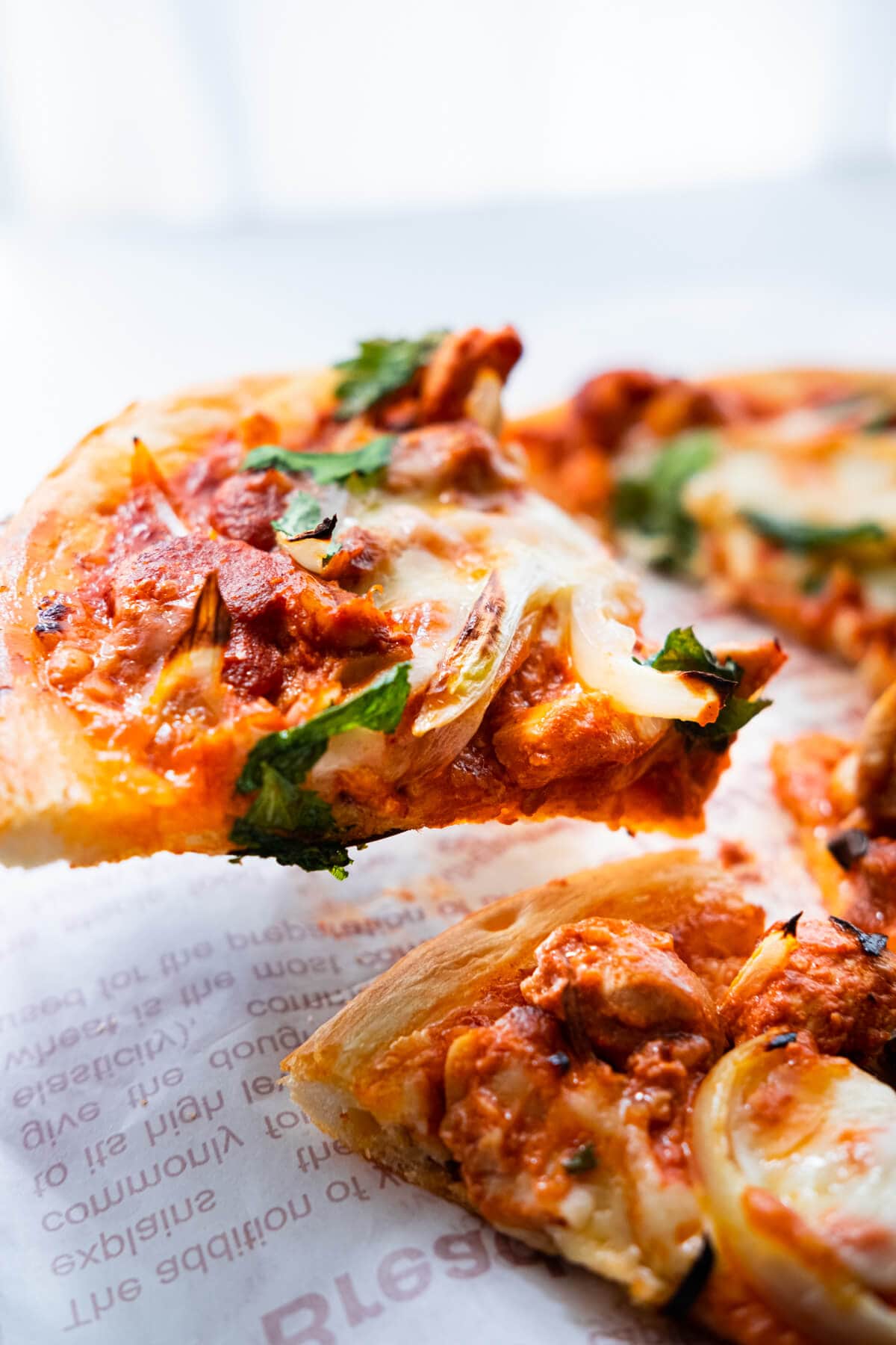 Cheesy Indian pizza topped with delicious Indian chicken tikka masala sauce and chicken. 
