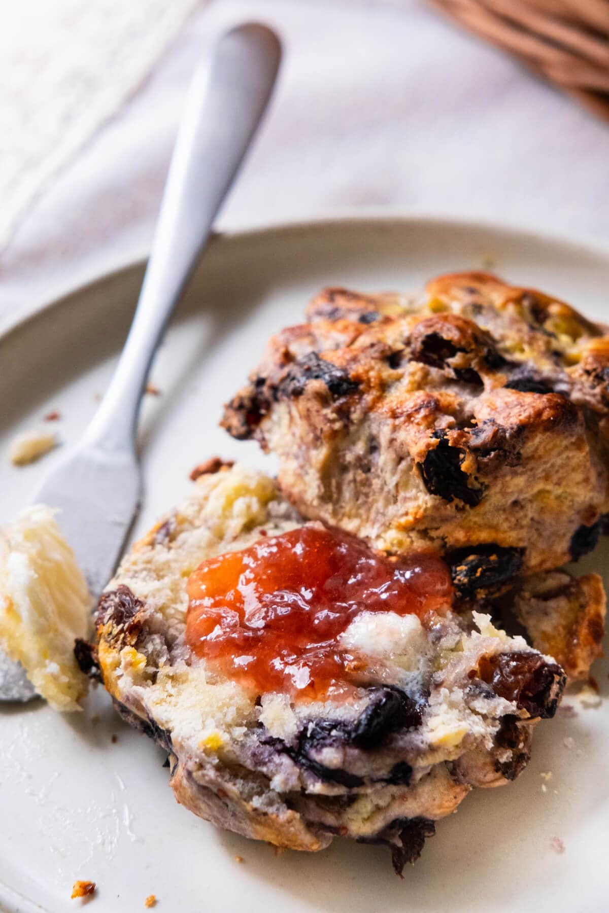 Freshly baked English scones served with strawberry jam. 