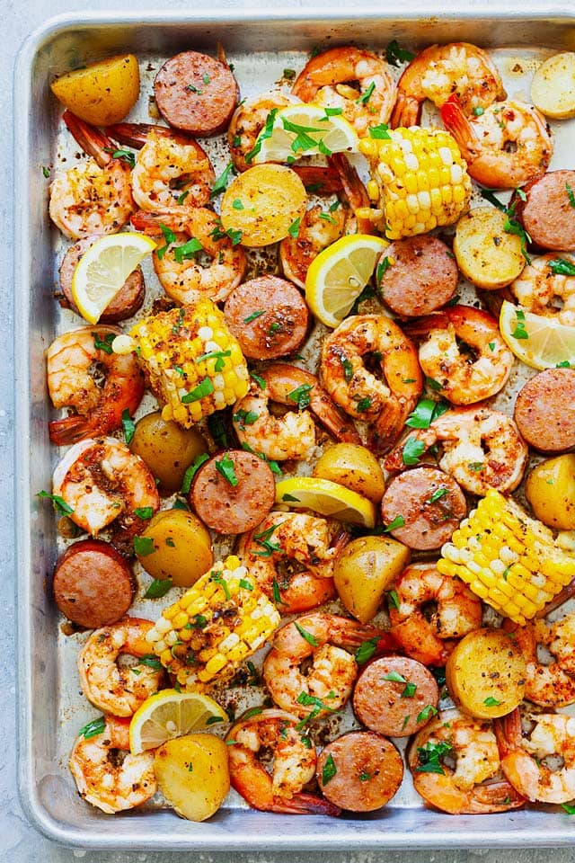 Shrimp boil recipe with old bay, shrimp, potatoes, corn and smoked sausages in shrimp boil Cajun seasoning.