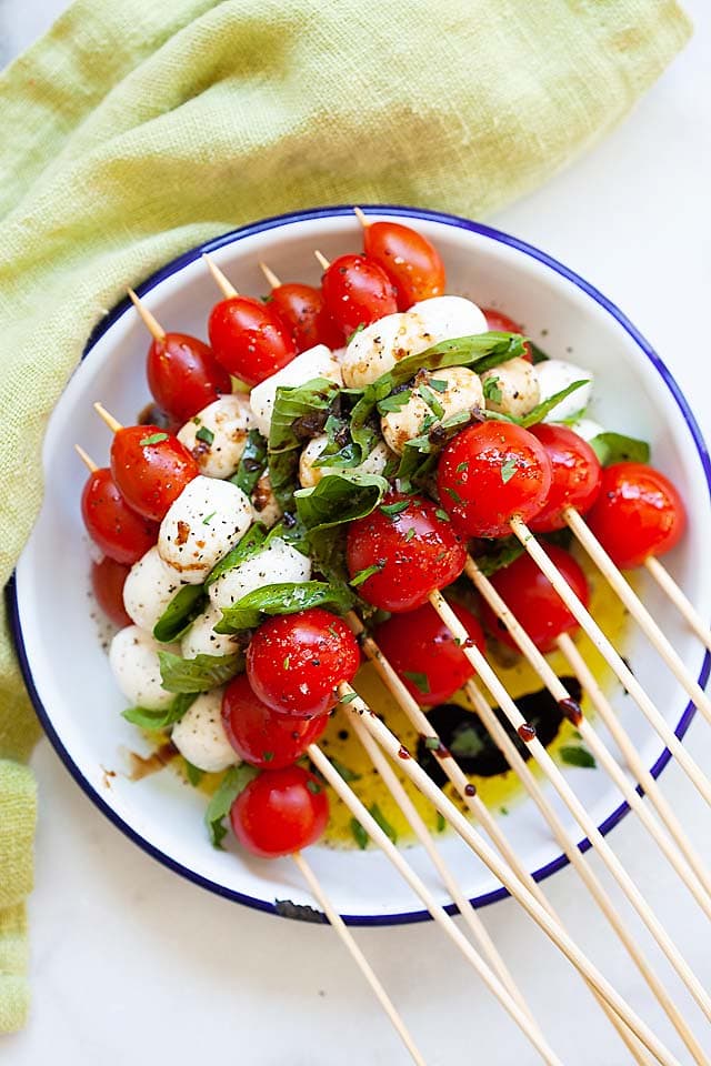 Caprese skewers on a plate, ready to serve.
