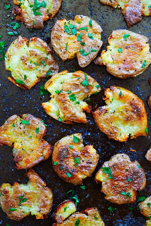 Smashed potatoes on a baking sheet.