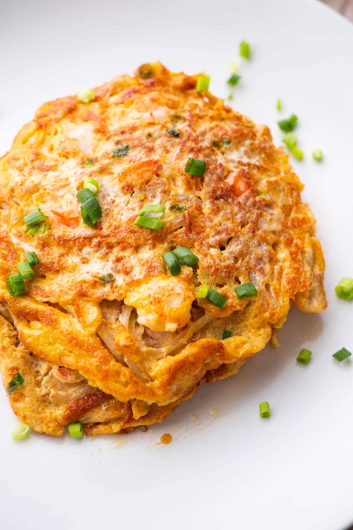 Egg foo young with pork and vegetable filling, a delicious Chinese omelet.