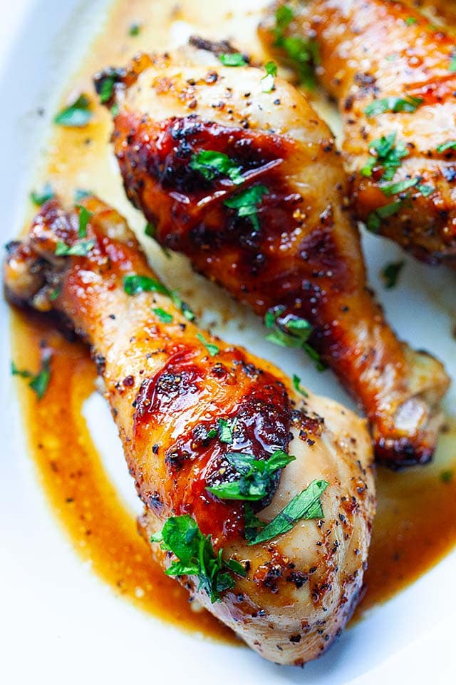 Baked chicken legs on a serving platter.