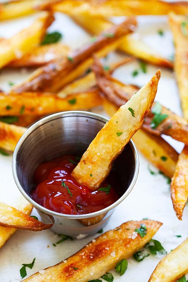 Baked French fries on a baking sheet, ready to serve.