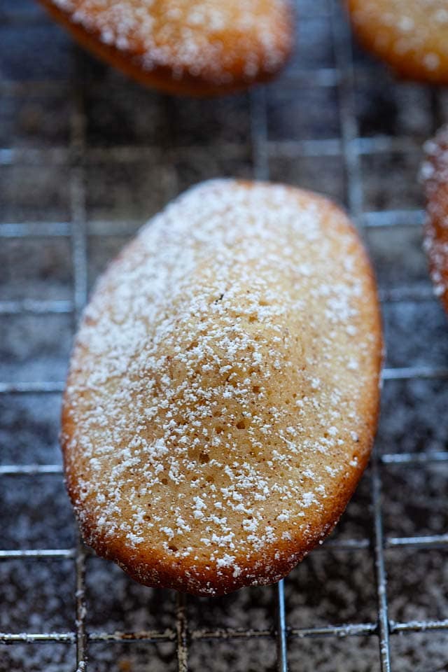 Madeleine cookies, dusted with powdered sugar.