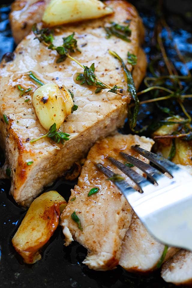 Cook the pork chops on skillet first before baking in the oven.