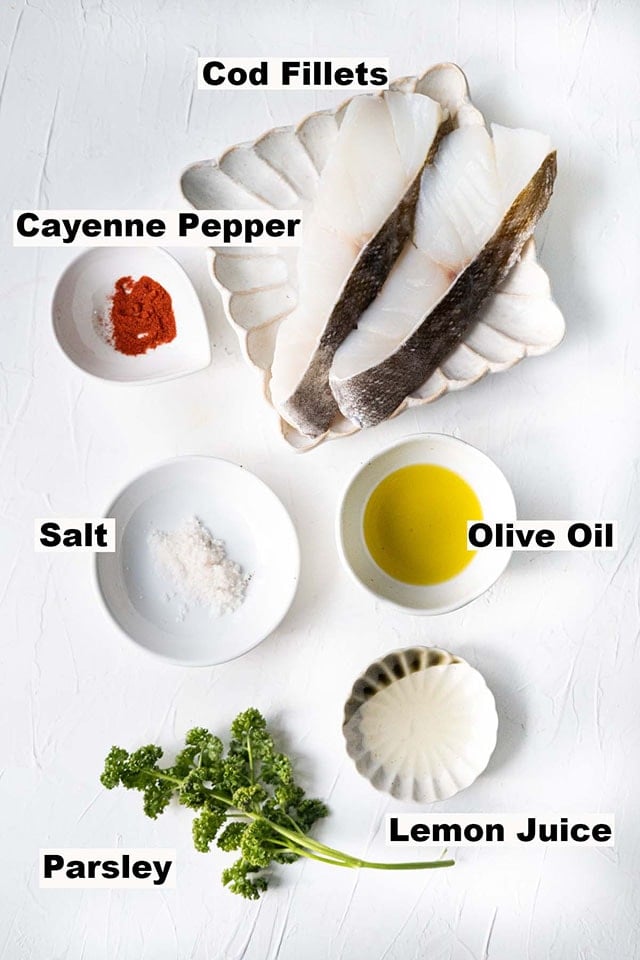 Recipe ingredients for baked cod: cod fillets, olive oil, lemon juice, parsley, salt and cayenne pepper. 