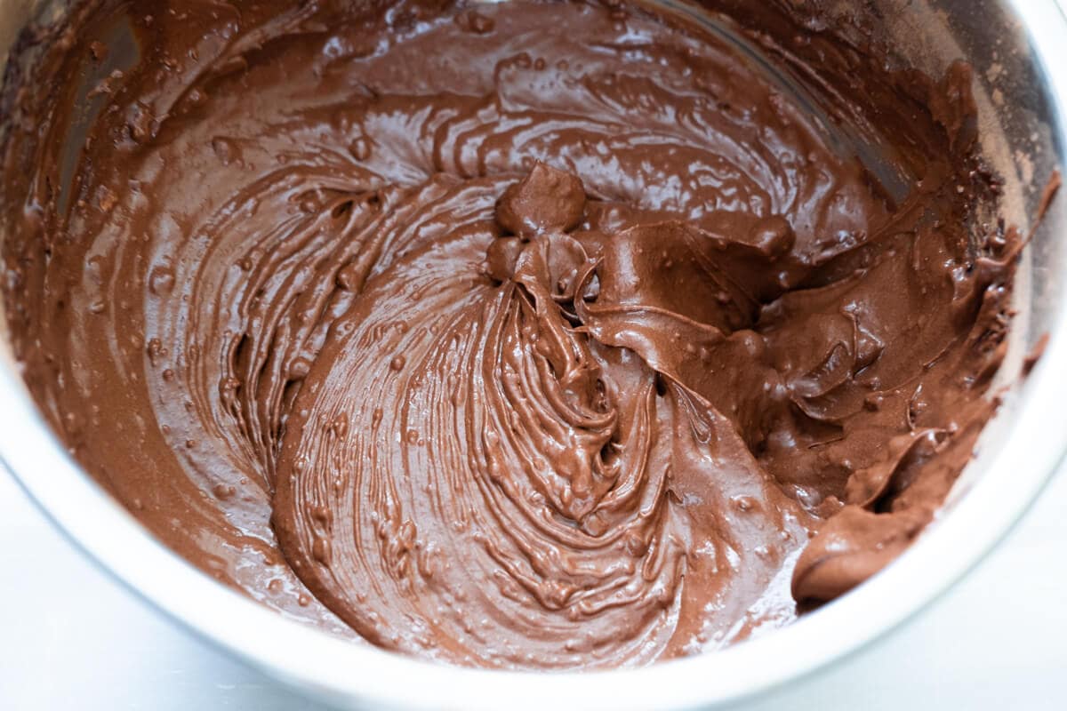 Beat the cocoa, granulated sugar, butter, and egg until smooth in a bowl. 