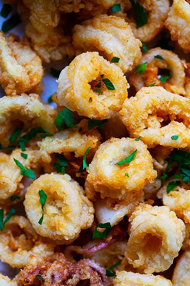 Fried calamari recipe Italian style with crispy coating and tomato sauce.