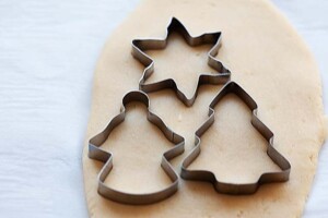 Cut out Christmas sugar cookies.