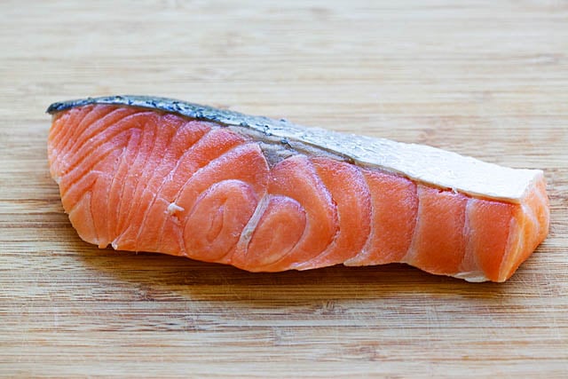 Wild caught salmon on a cutting board. 