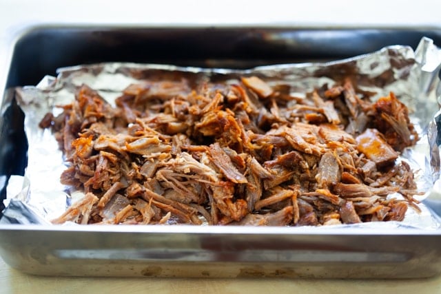 Smoked pulled pork in a smoker.