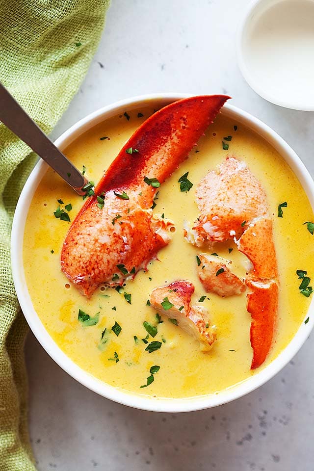 Lobster bisque served in a soup bowl.