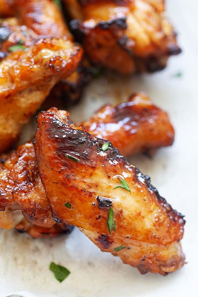 BBQ chicken wings on grill, ready to serve.