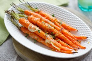 Garlic parmesan carrots on a plate.