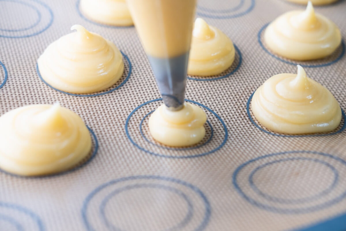 Pipe the dough onto a silicone mat. 