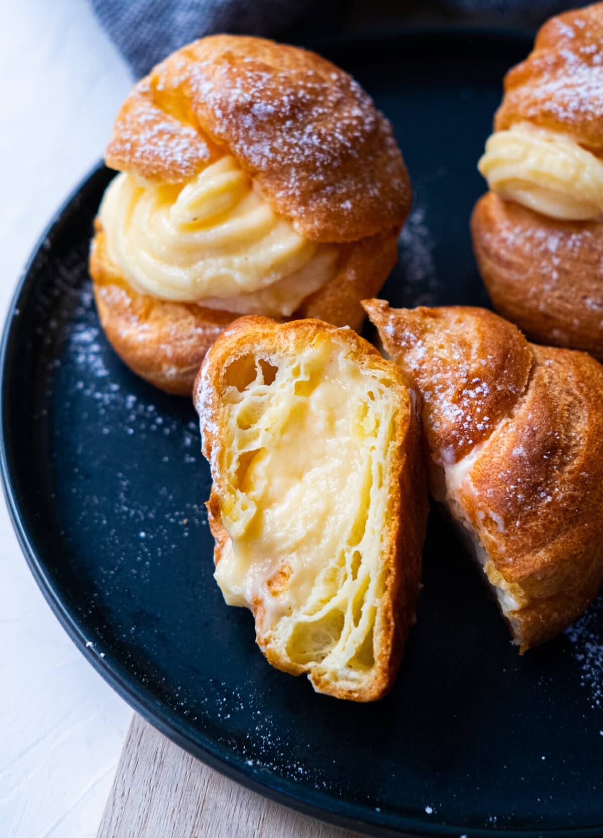 Big Japanese cream puff cut in half to show the delicious pastry cream.