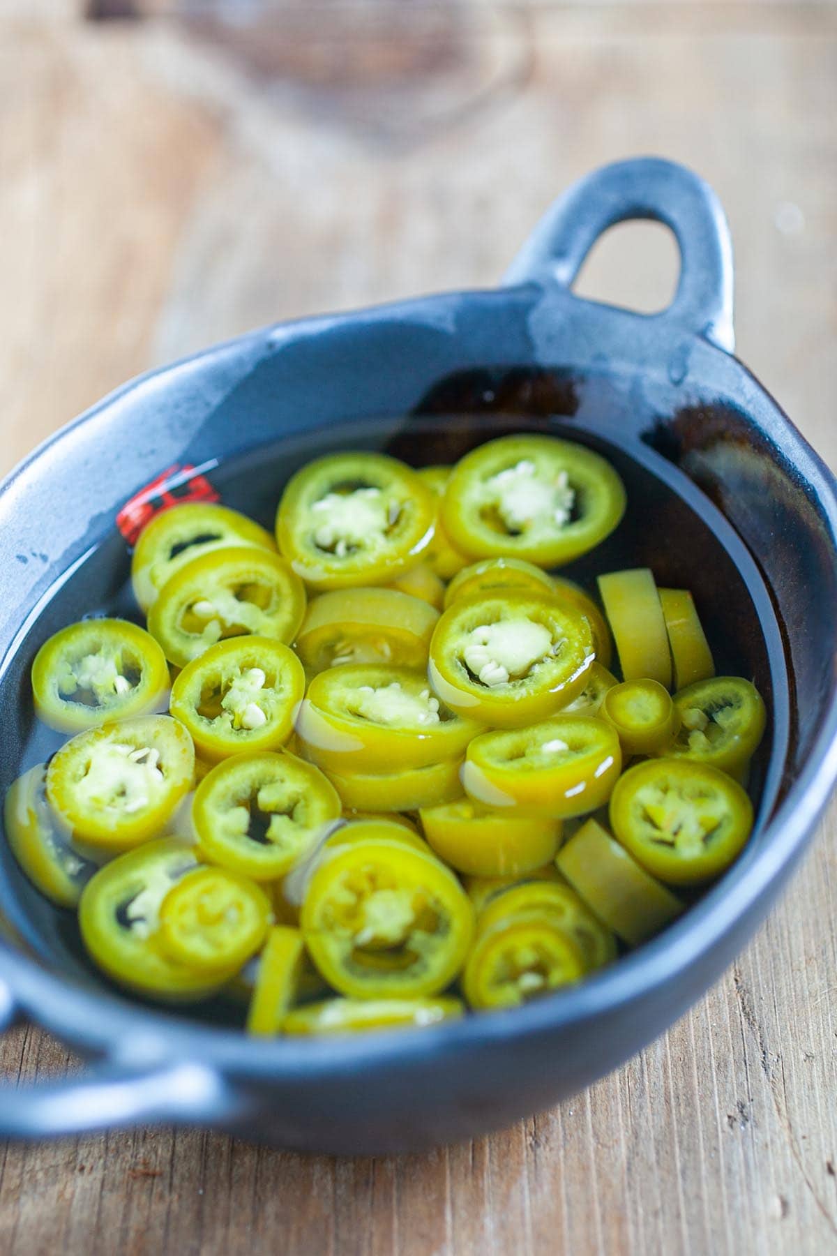 Pickled green chili is a popular condiment that accompanies many Southeast Asian street food and Asian noodle dishes. Have these for your guest for your Chinese New Years feast. | rasamalaysia.com
