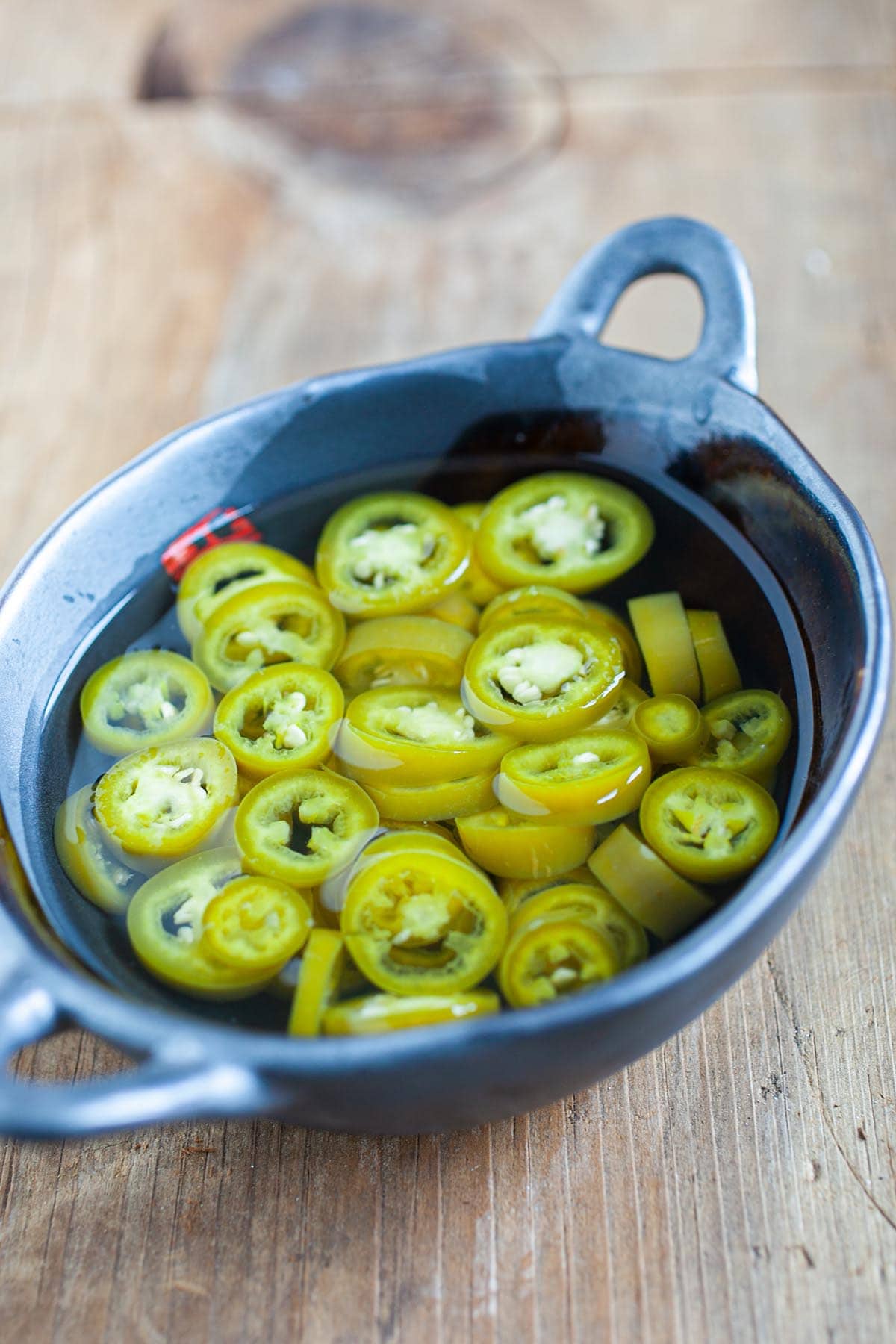 Pickled green chili is a popular condiment that accompanies many Southeast Asian street food and Asian noodle dishes. Have these for your guest for your Chinese New Years feast. | rasamalaysia.com