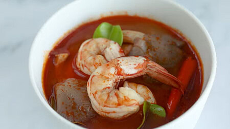 Cooked tom yum goong in a bowl.