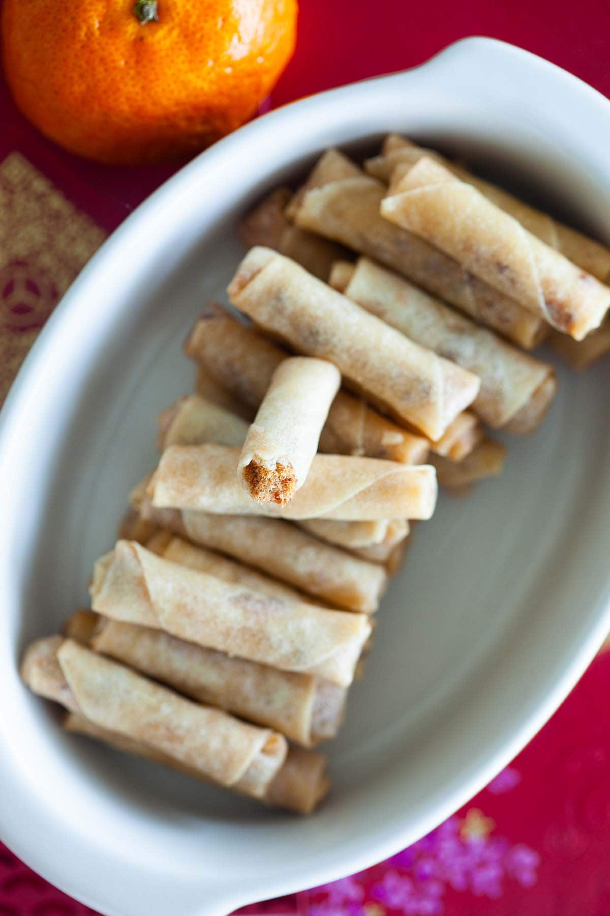 These mini spring rolls are filled with chicken floss and deep-fried.