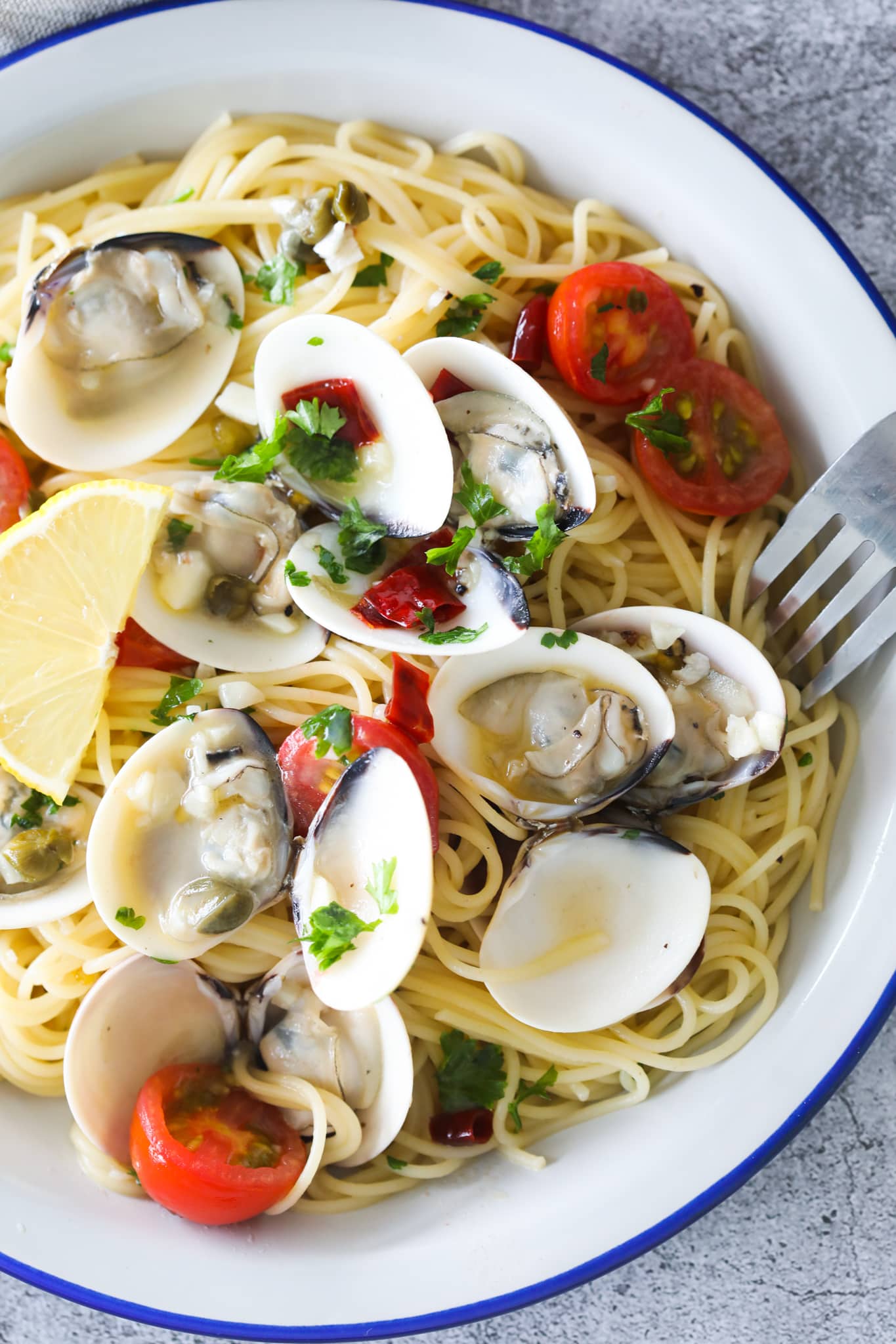 Capellini pasta with tomatoes and clams.