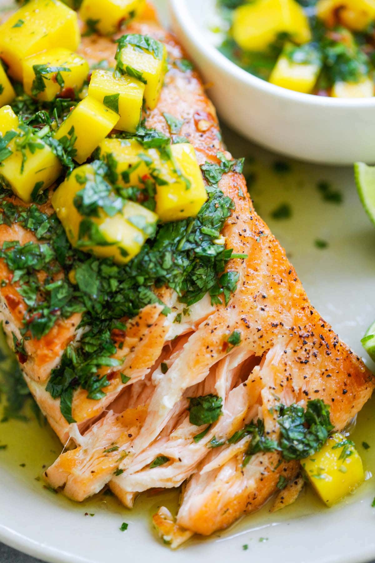 The best chimichurri salmon recipe ever with mango. So easy, restaurant quality and perfect for dinner tonight.