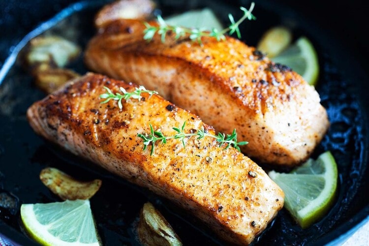 Pan seared salmon fillets with skin.
