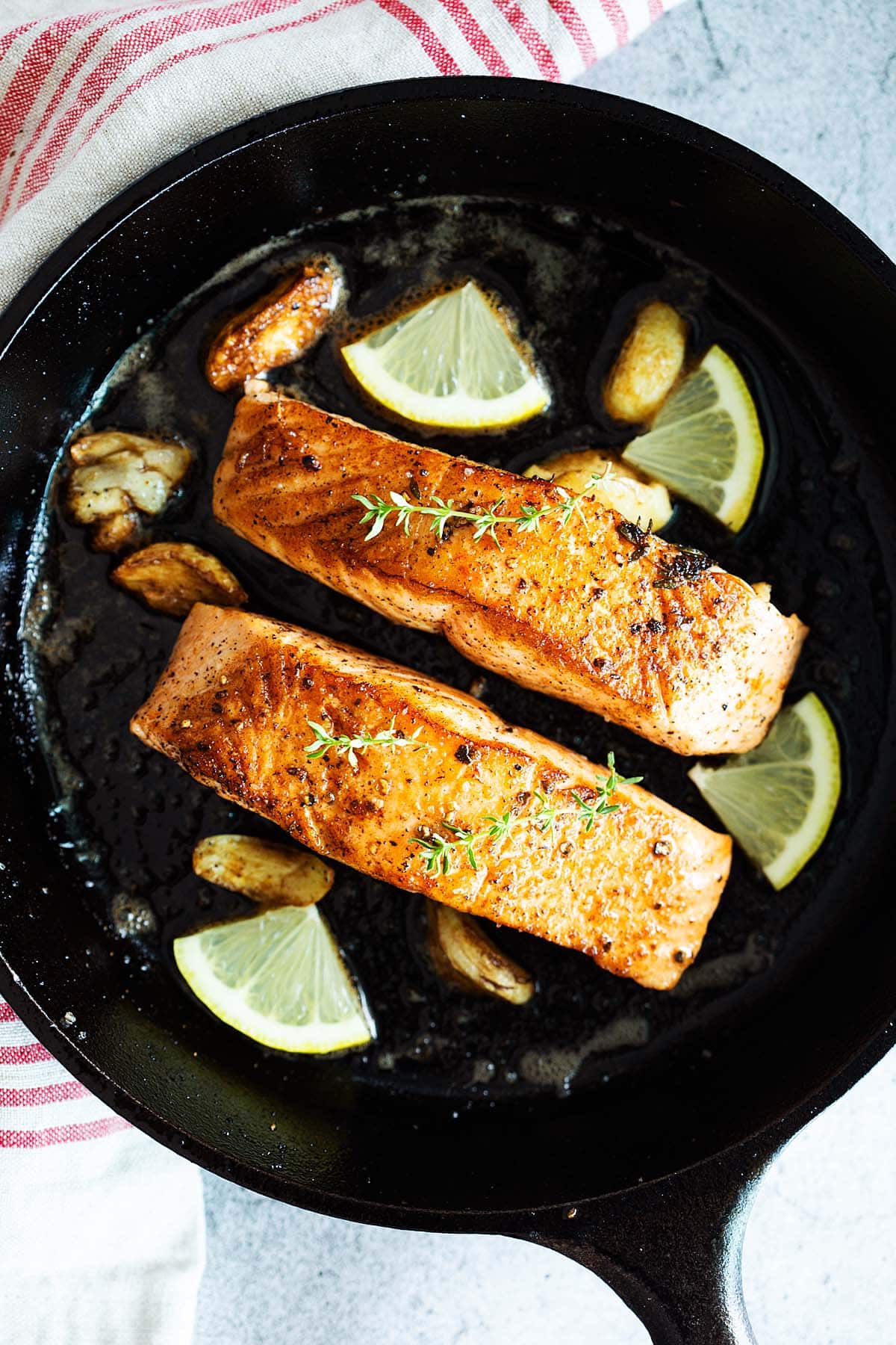 Pan seared salmon in a skillet. 