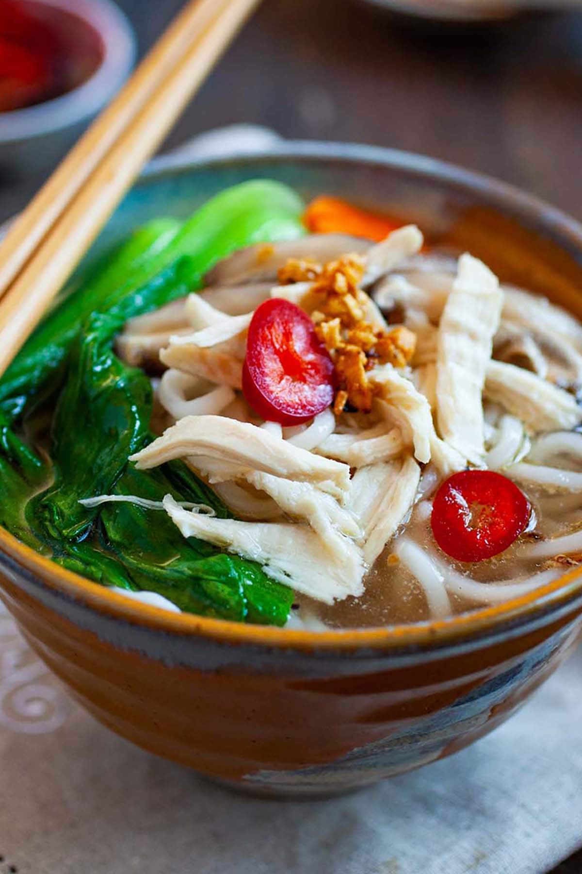 Chinese chicken noodle soup made with chicken broth and fresh wheat noodles.