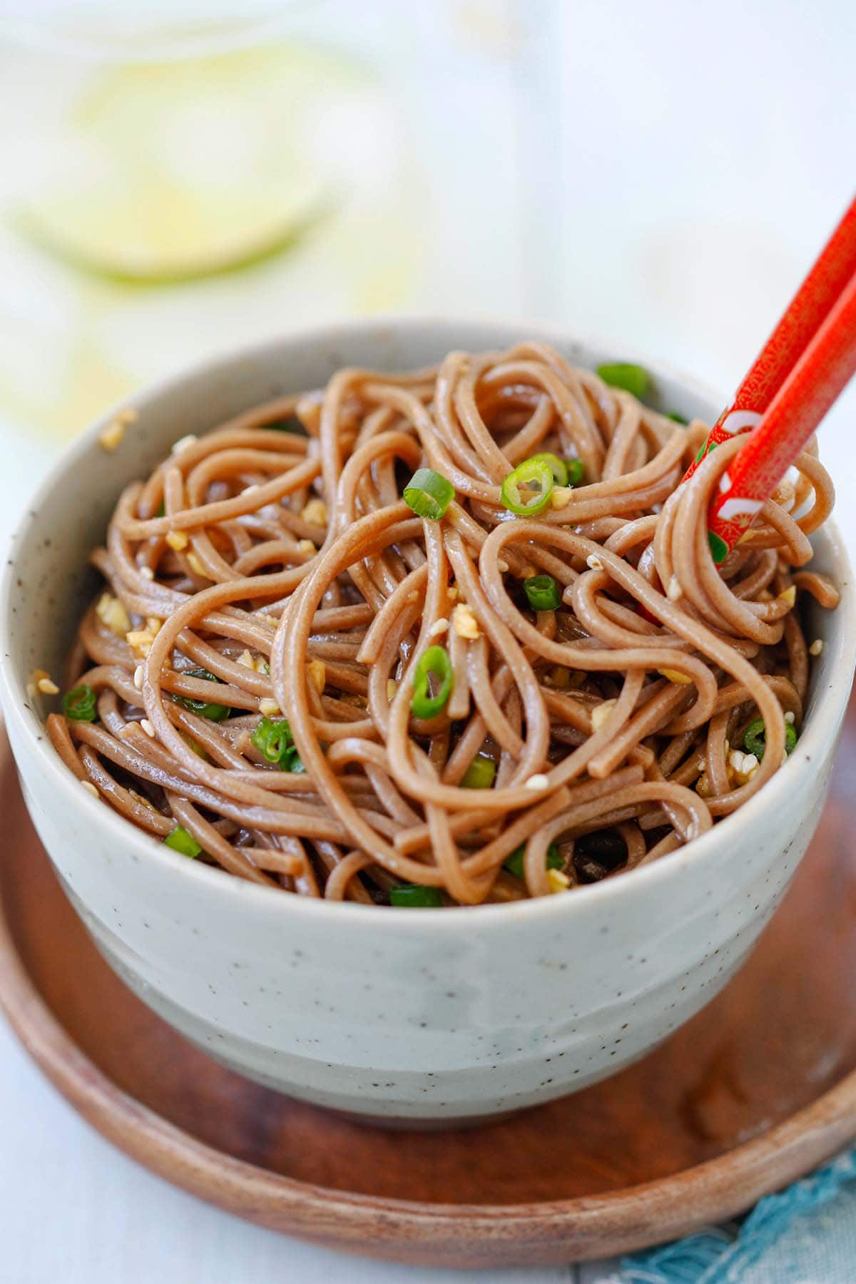 Ginger Soy Soba with ginger, soy sauce, honey and Japanese soba noodles in a bowl.