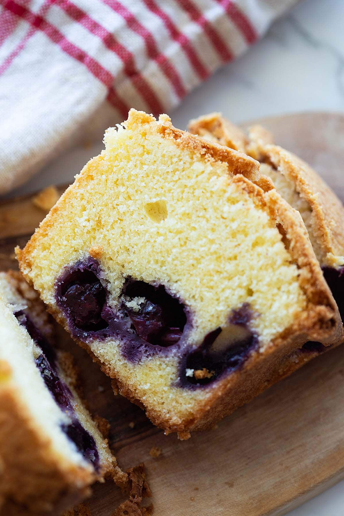 Blueberry pound cake loaf, sliced into pieces.