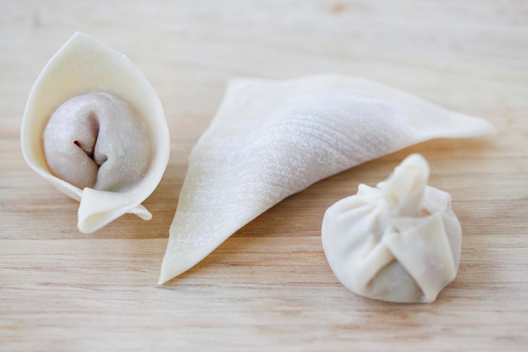 Three wonton folding techniques: cat's ears, triangles, and simple Hong Kong style wrap.