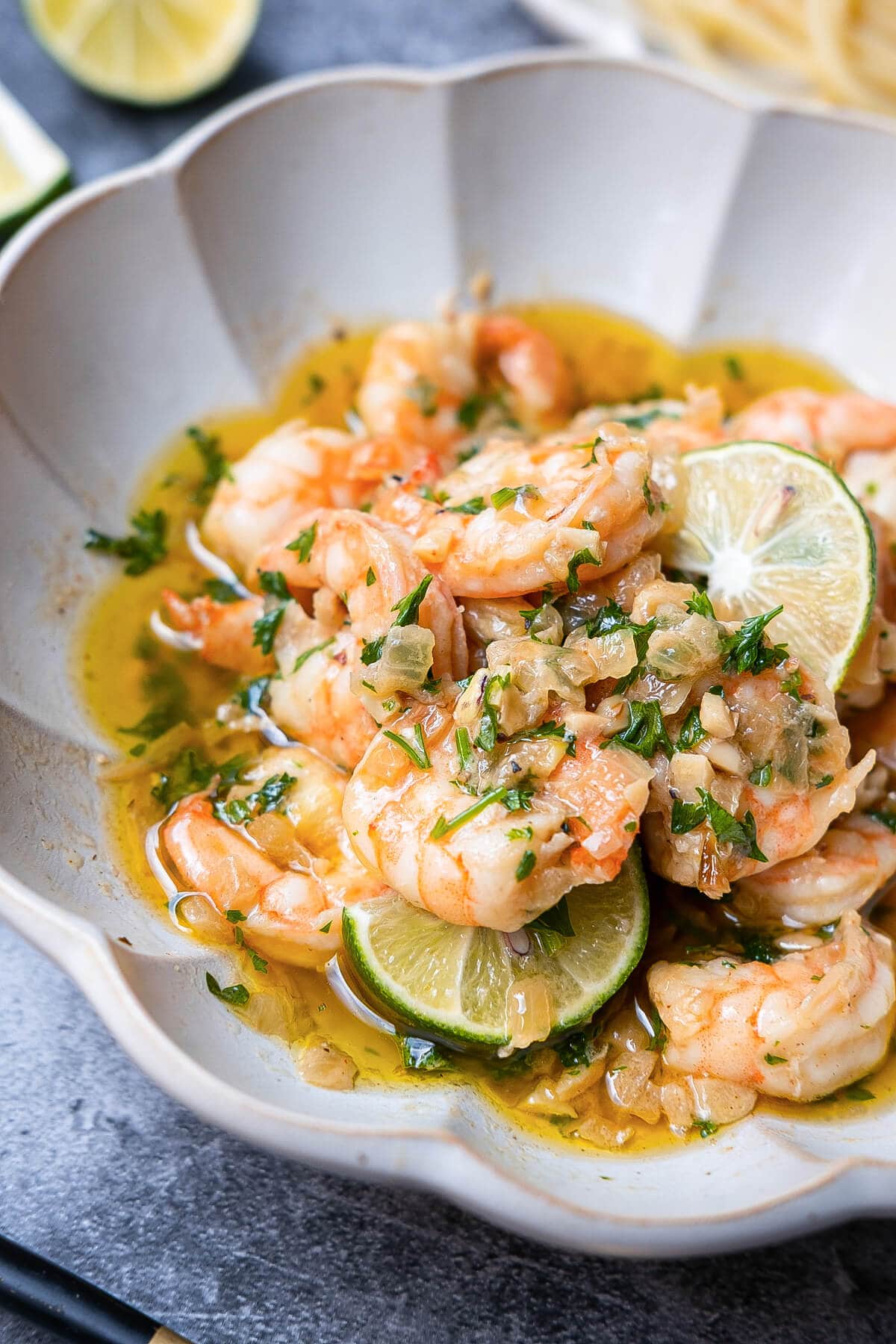 A tantalizing view of shrimp bathed in a flavorful garlic and white wine sauce. 