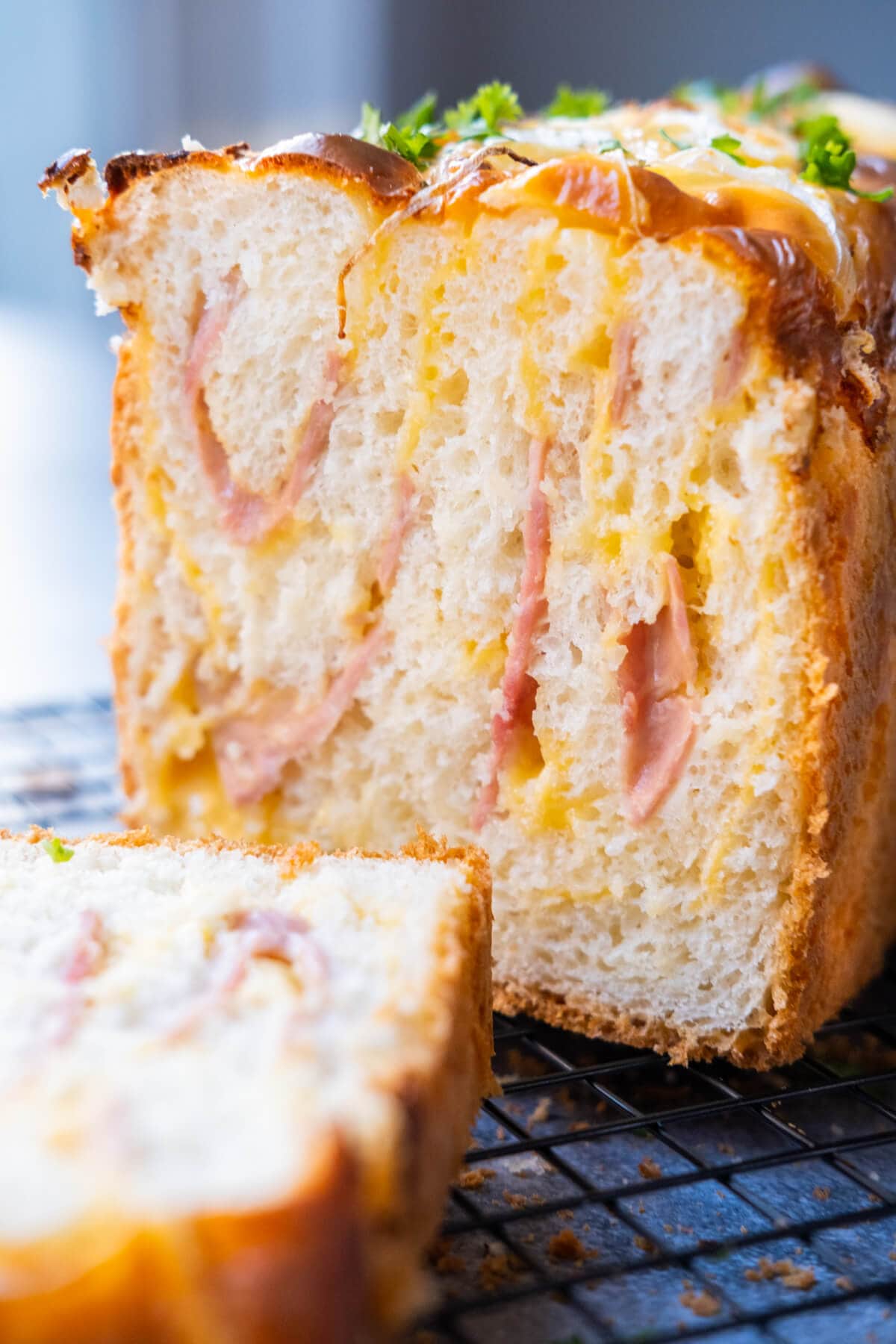 Ham and cheese loaf, sliced into pieces.