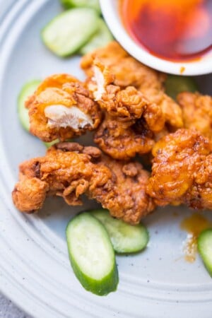 Hot chicken tenders served on a plate.