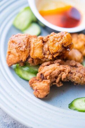 Crispy and flavorful fried chicken tenders served on a plate. 