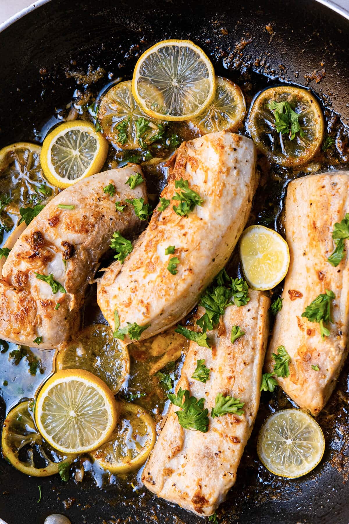 Garlic butter mahi-mahi, featuring perfectly cooked mahi-mahi fillets bathed in a luscious garlic butter sauce.