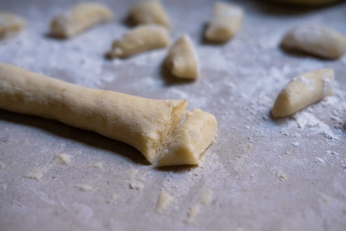 Cut the gnocchi dough into small pieces.