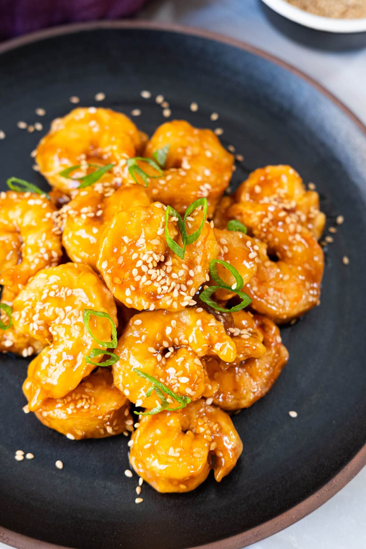 Sesame shrimp on a plate, ready to serve.