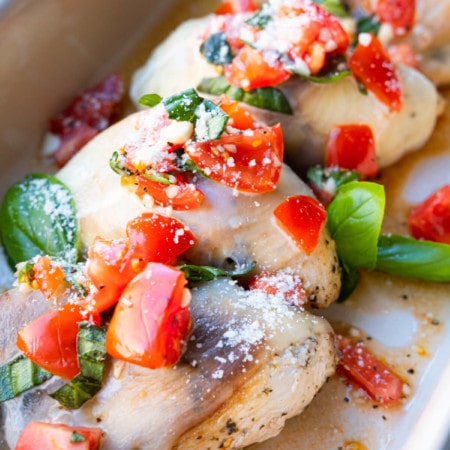 Juicy and flavorful Bruschetta chicken topped with tomato, basil and grated parmesan cheese.