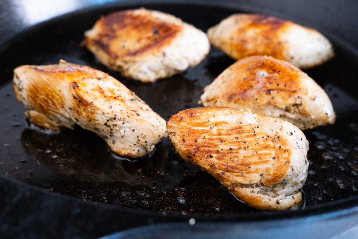 Cook the chicken breast on a cast-iron skillet. 