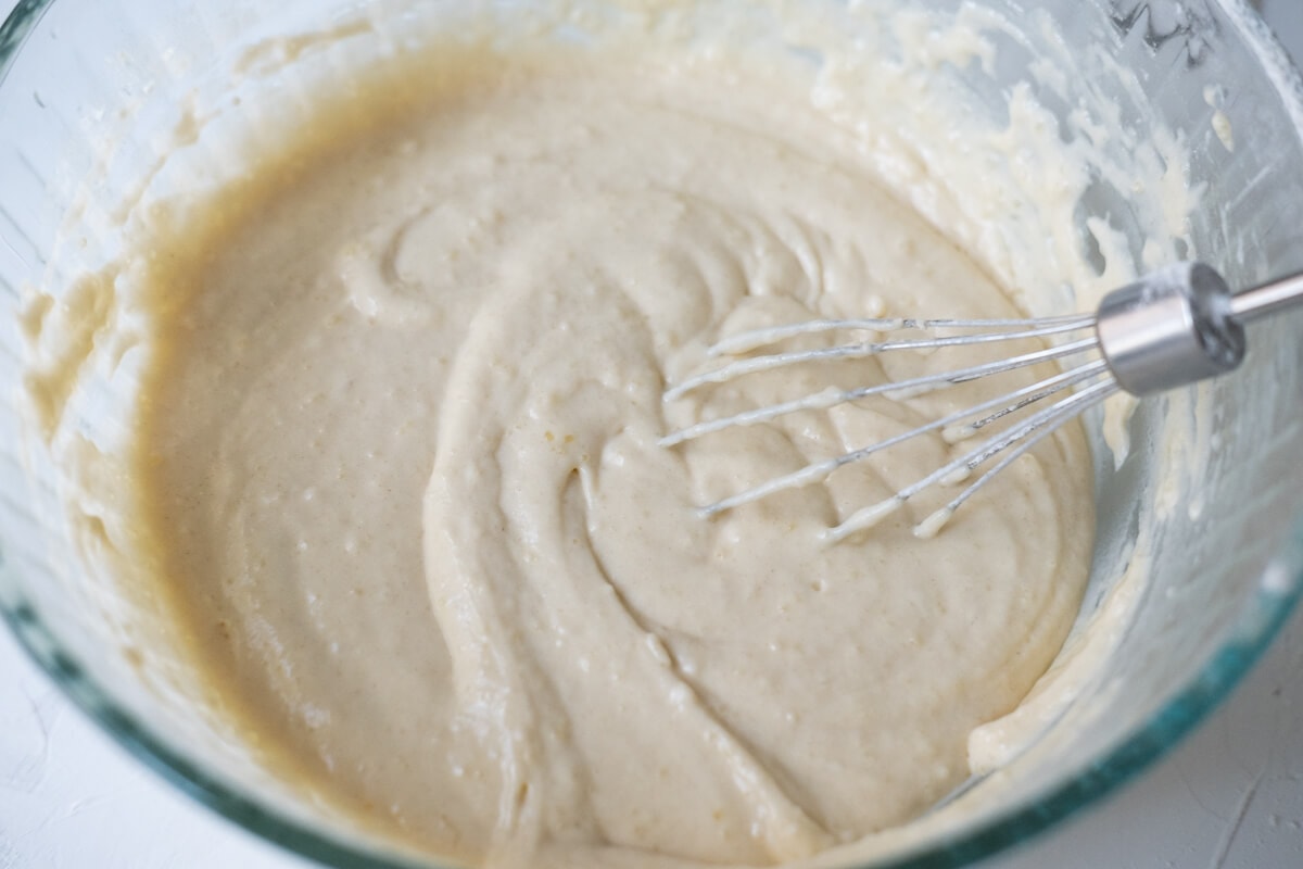 Mixture of all-purpose flour, sugar, and baking powder mixed in a bowl.