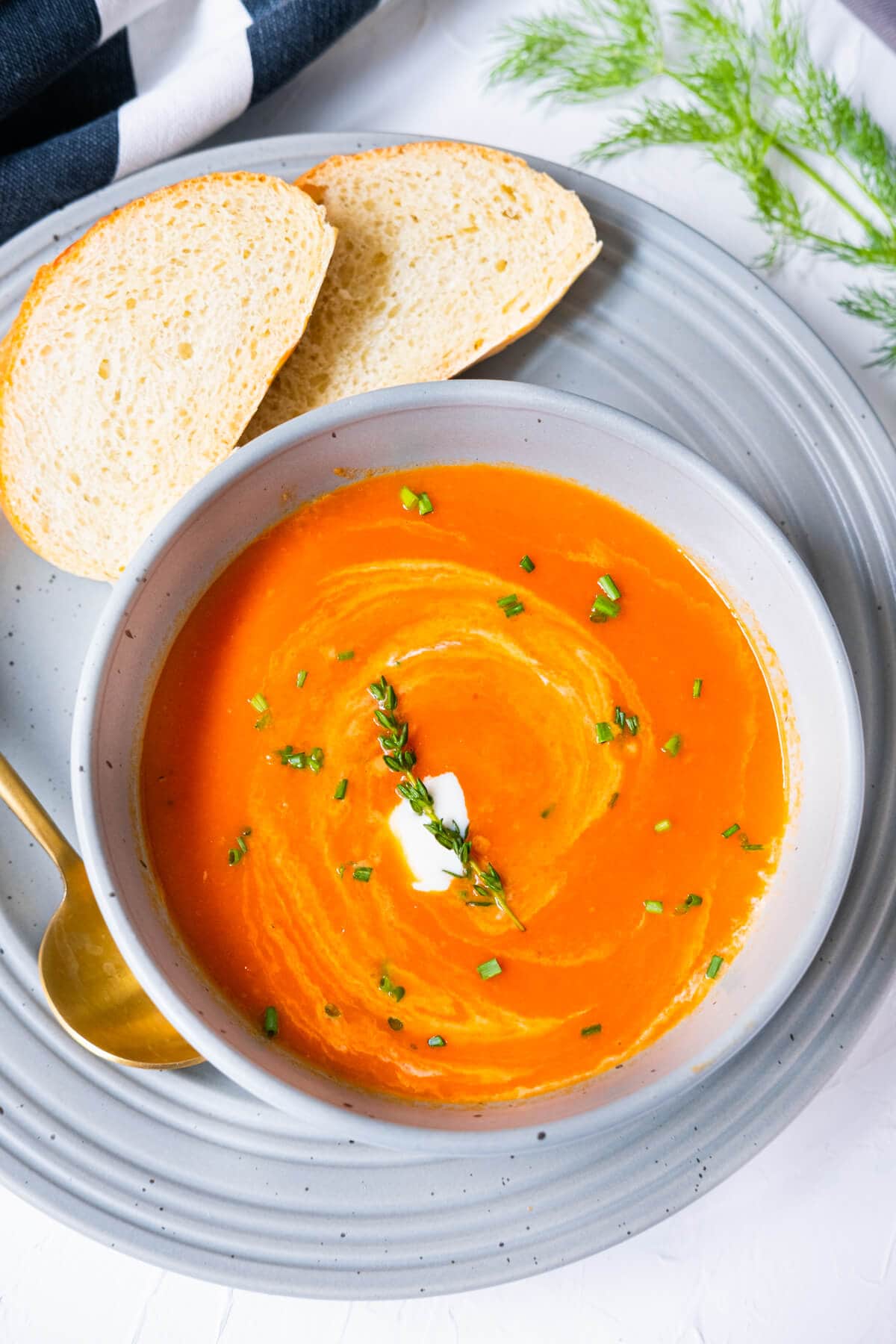 Classic tomato soup topped with Crème fraîche, finely chopped chives and a sprig of thyme. 