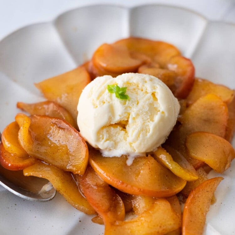 Fried apples with ice cream on top.