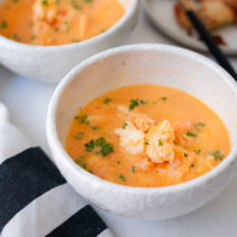 Shrimp bisque loaded with succulent shrimp and topped with chopped parsley.